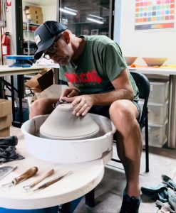 Todd Youngs on a pottery turning wheel