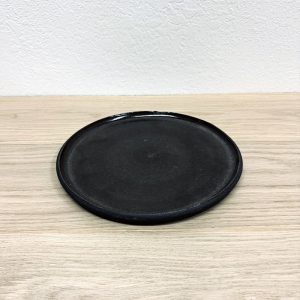 black ceramic dinner plate